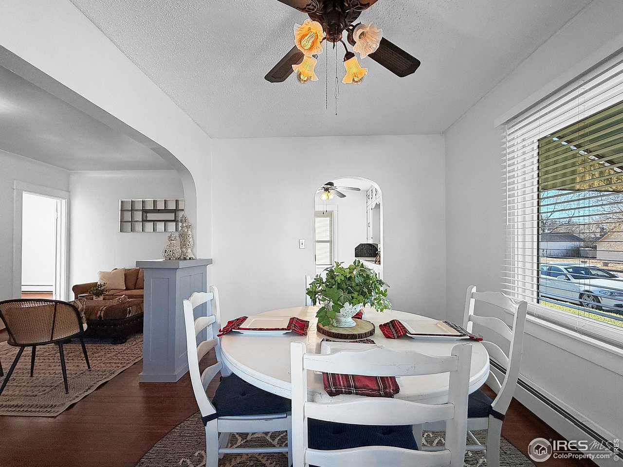 531 Taylor Street Sterling, CO 80751 - Photo 15 of 38 a view of a dining room with furniture window and wooden floor