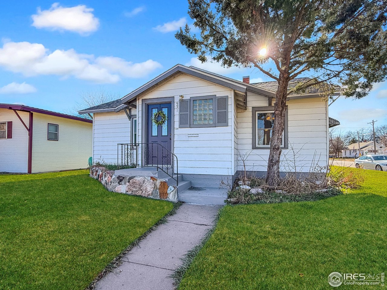 531 Taylor Street Sterling, CO 80751 - Photo 2 of 38 a front view of house with yard and green space