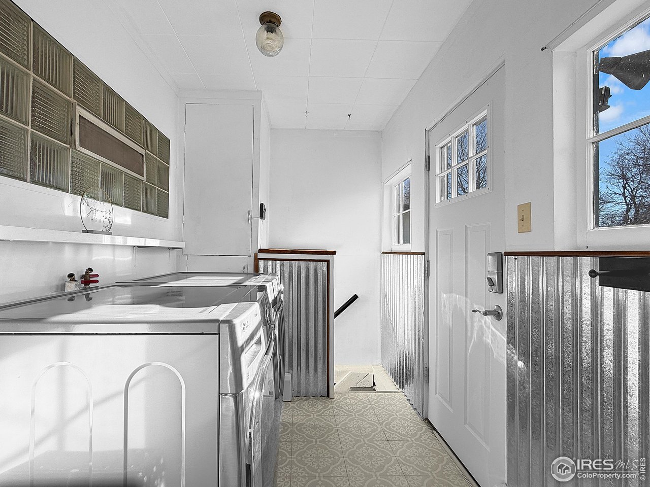 531 Taylor Street Sterling, CO 80751 - Photo 22 of 38 a view of entryway with kitchen and wooden floor
