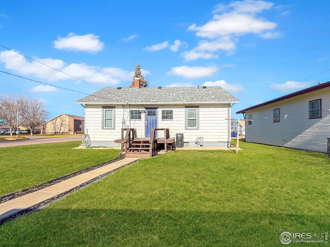531 Taylor Street Sterling, CO 80751 - Photo 28 of 38 a view of a house with a yard and sitting area