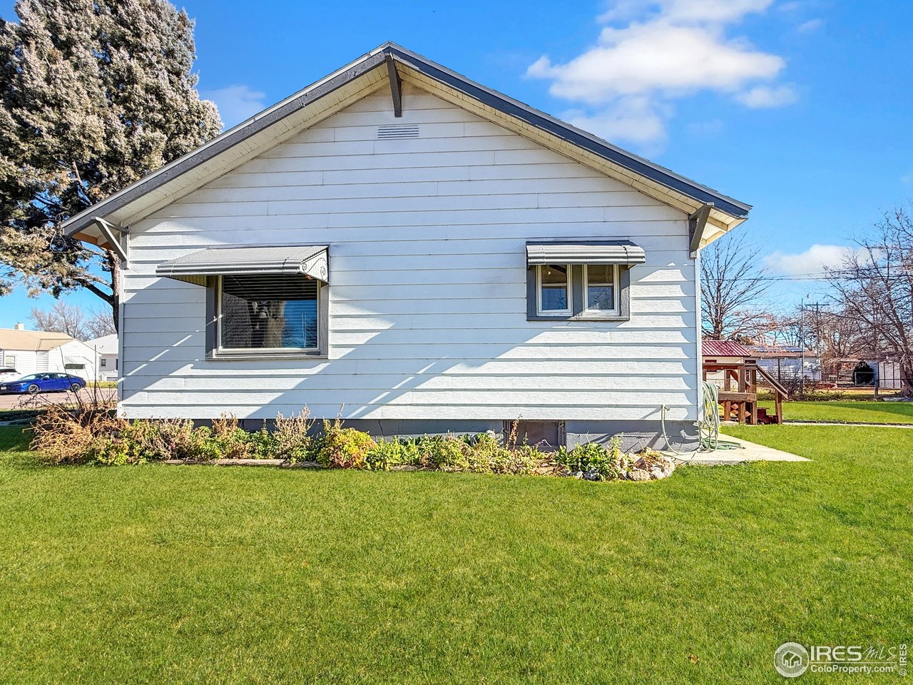 531 Taylor Street Sterling, CO 80751 - Photo 29 of 38 a front view of a house with a yard