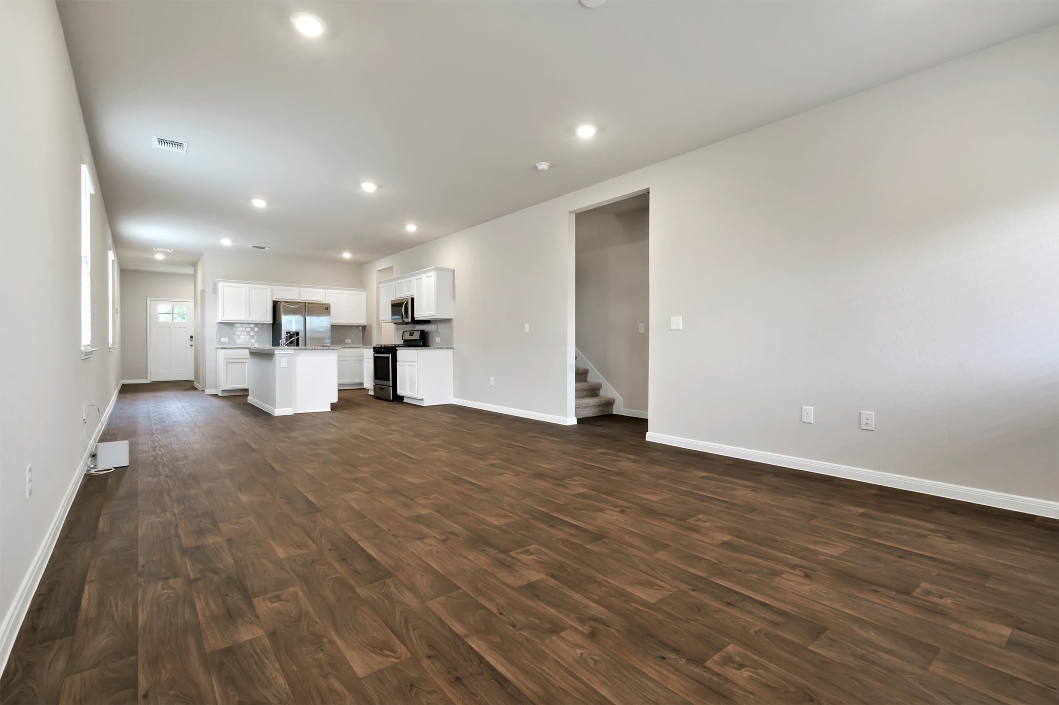 2909 Tweedy Trail Pflugerville, TX 78660 - Photo 8 of 27 An open-concept layout unites the spacious living area with a contemporary kitchen.