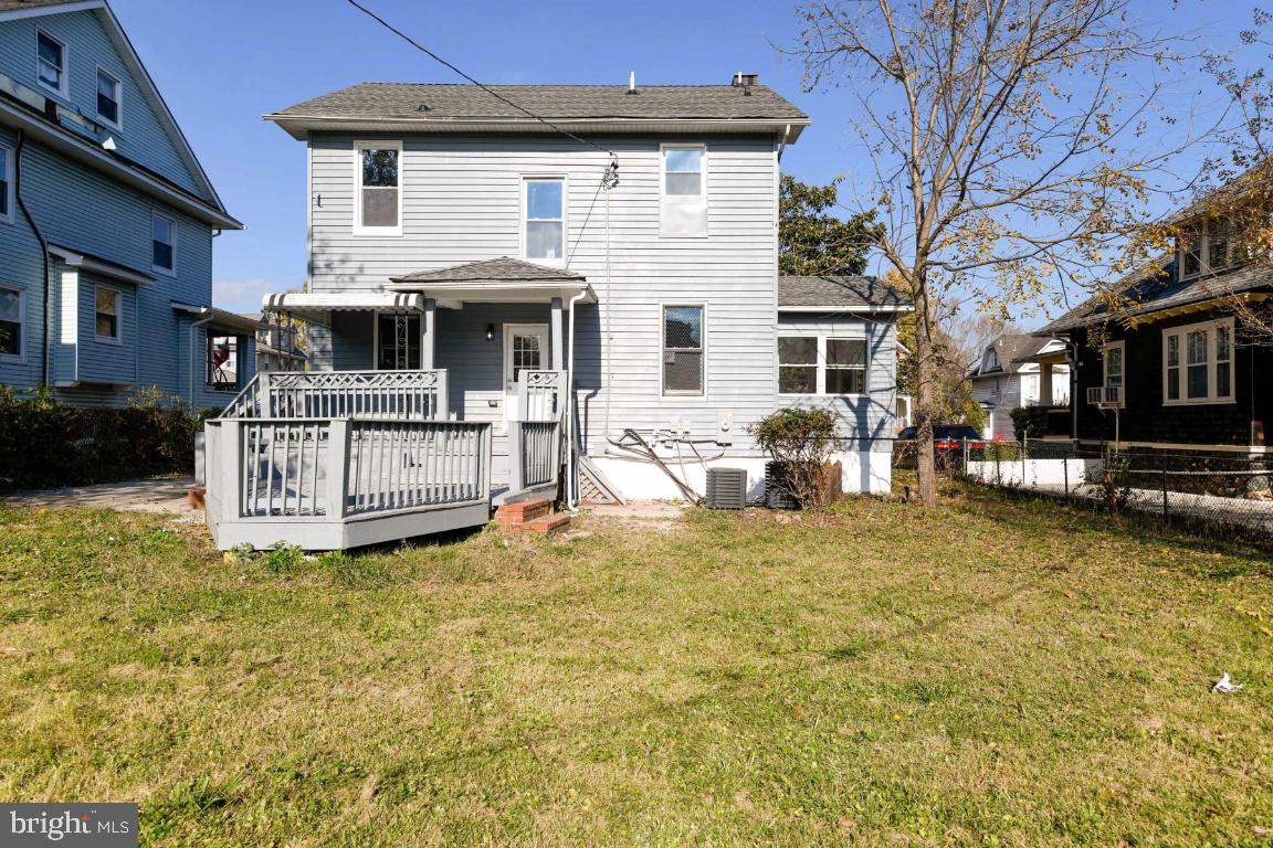 3815 Chatham Road Baltimore, MD 21215 - Photo 13 of 28 a view of a house with a yard patio and fire pit