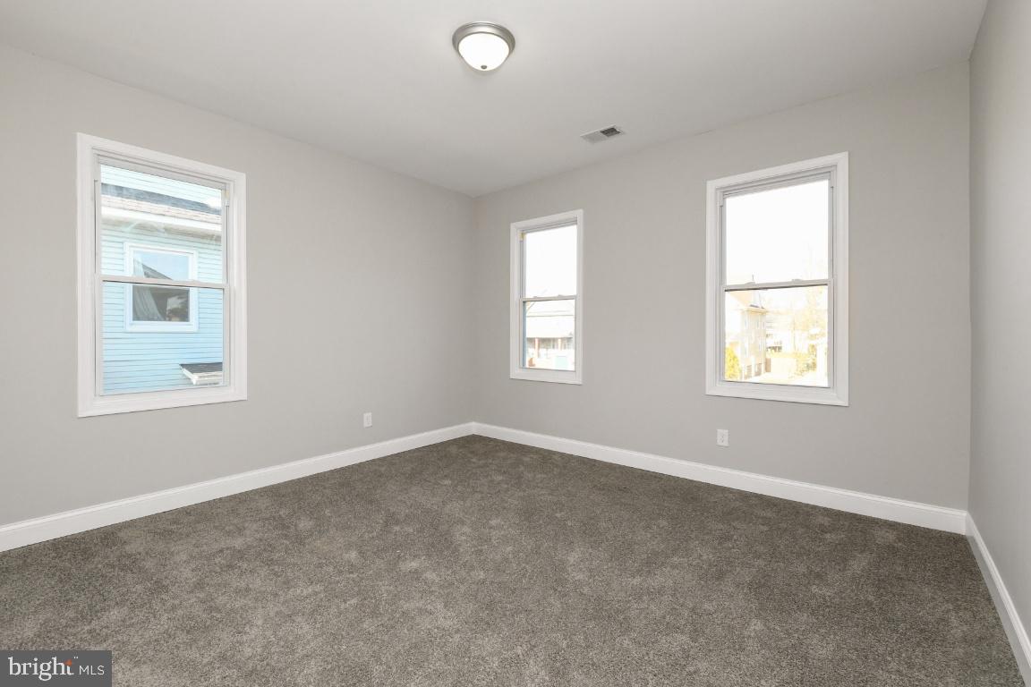 3815 Chatham Road Baltimore, MD 21215 - Photo 23 of 28 an empty room with windows