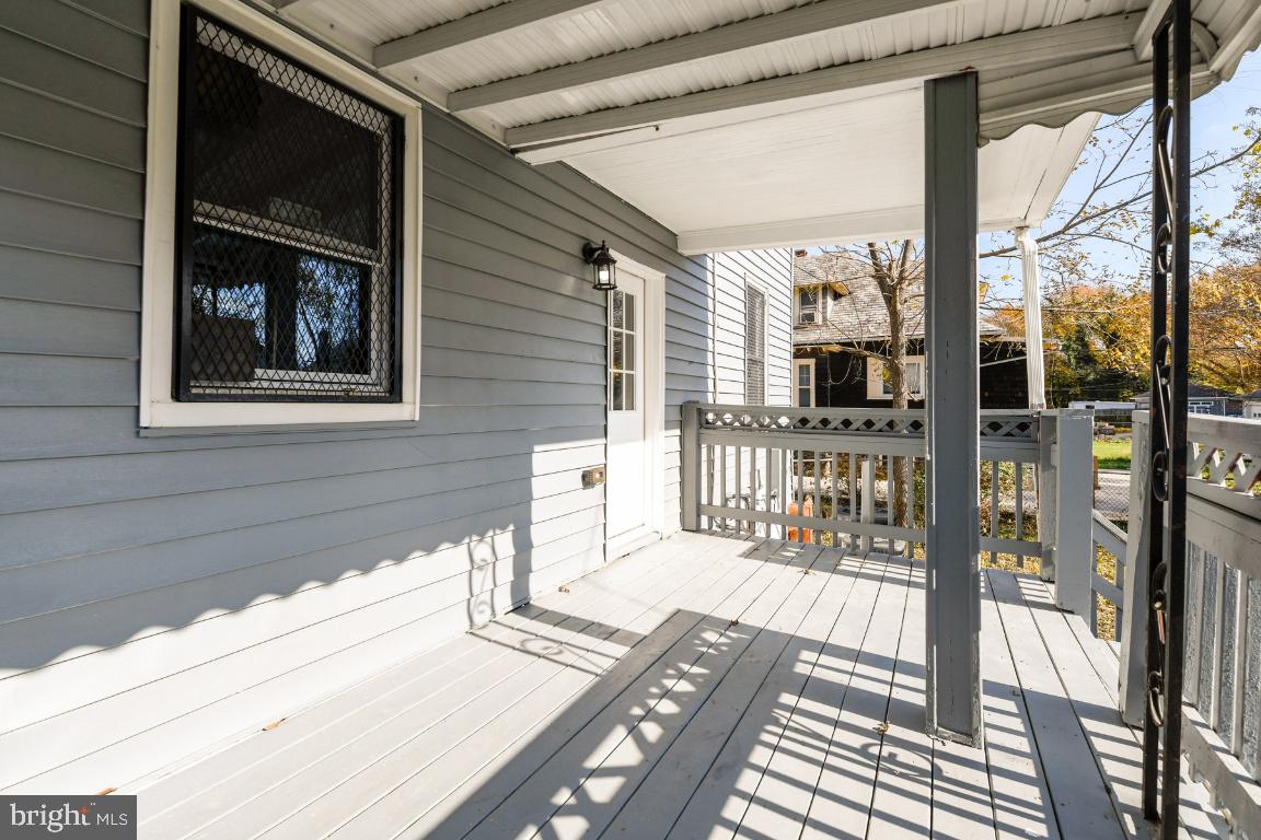 3815 Chatham Road Baltimore, MD 21215 - Photo 4 of 28 a view of a balcony with wooden floor