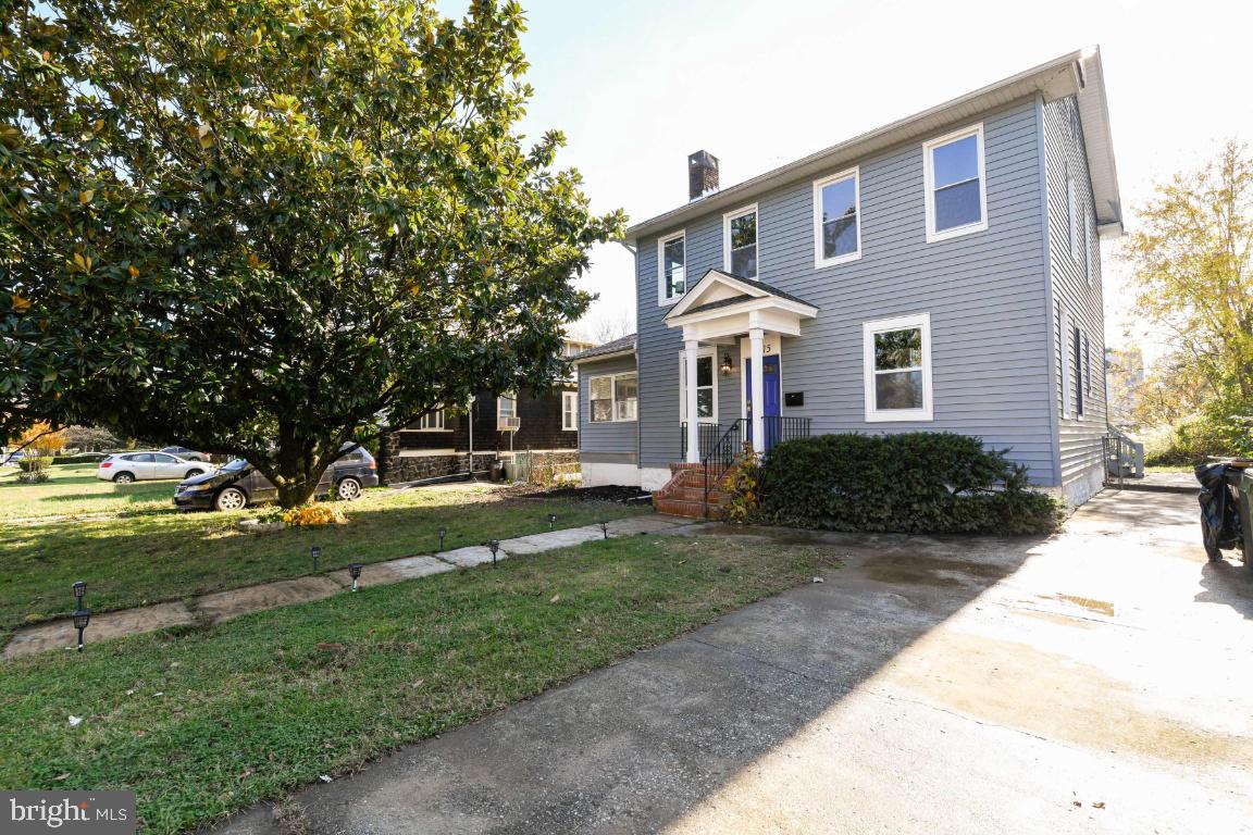 3815 Chatham Road Baltimore, MD 21215 - Photo 8 of 28 a front view of a house with a yard