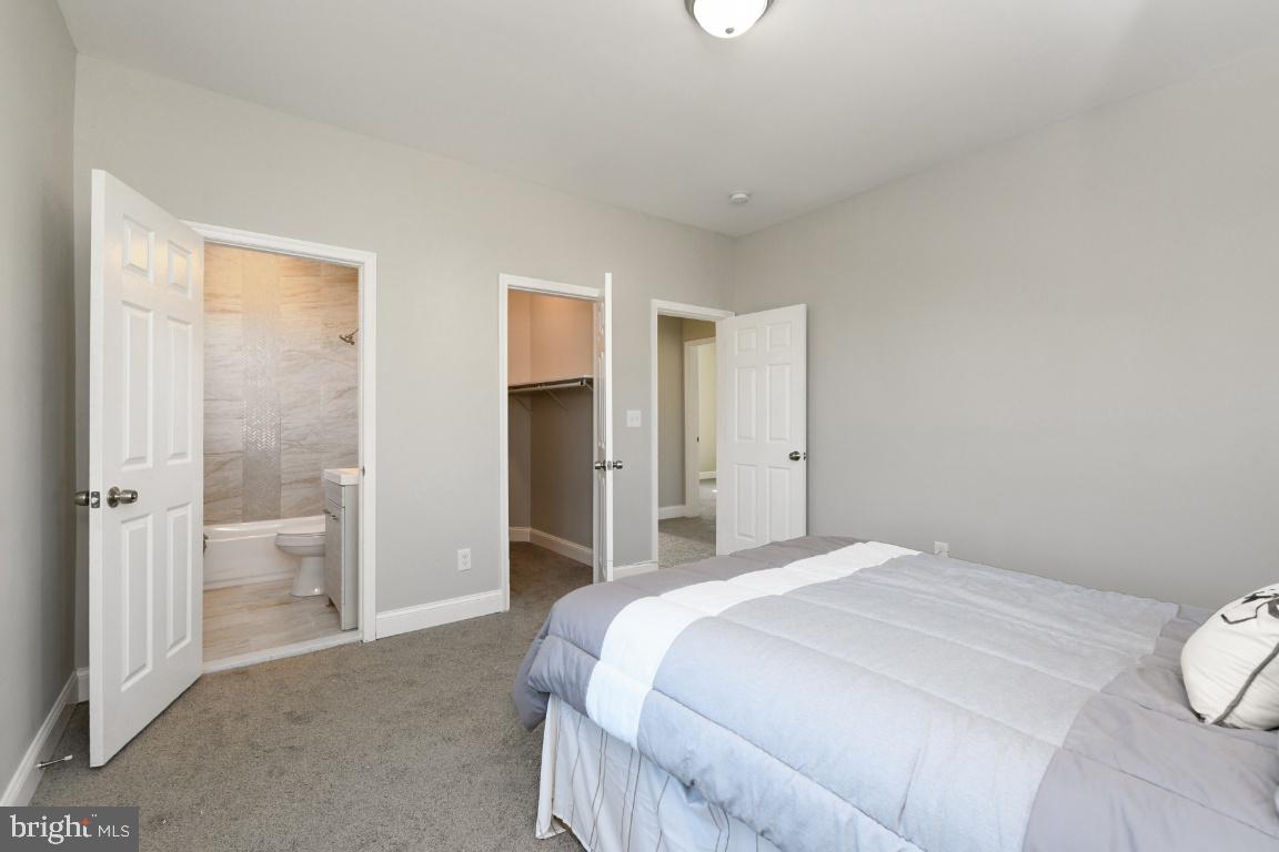 3815 Chatham Road Baltimore, MD 21215 - Photo 10 of 28 a bedroom with a bed and a view of bathroom
