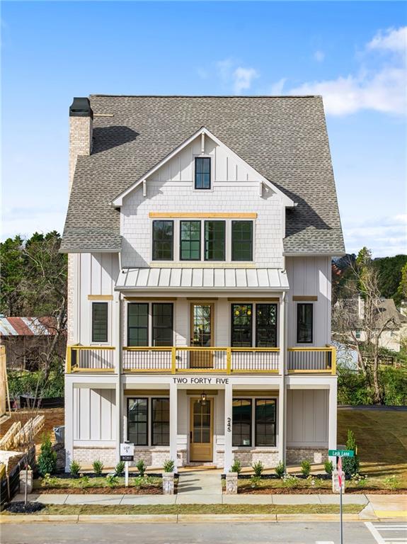 a front view of a residential apartment building with a yard