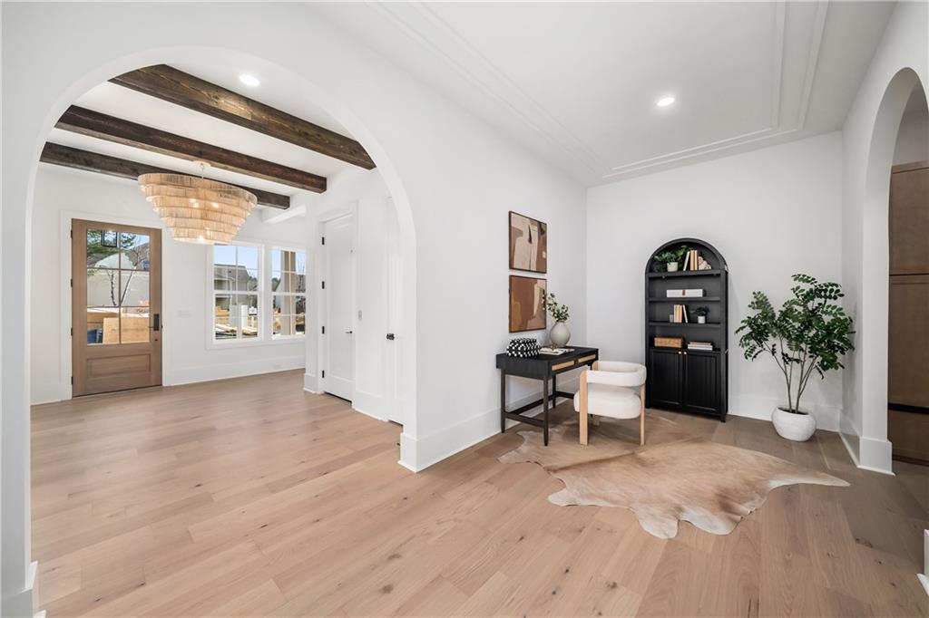245 Lask Lane Milton, GA 30004 - Photo 13 of 87 a view of a livingroom with wooden floor and furniture
