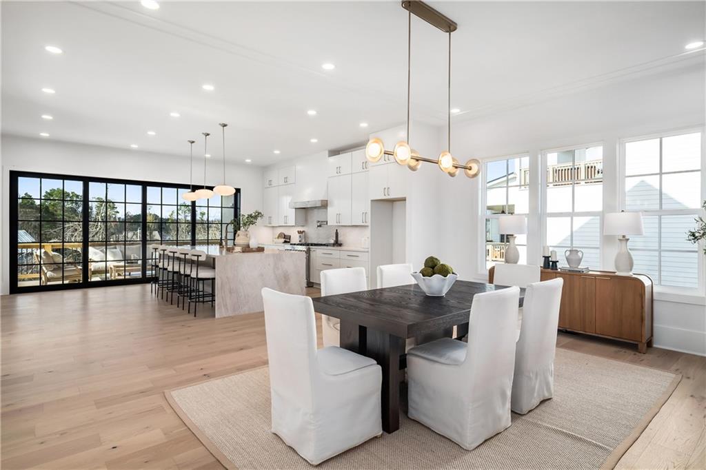 245 Lask Lane Milton, GA 30004 - Photo 19 of 87 a dining room with furniture and a floor to ceiling window