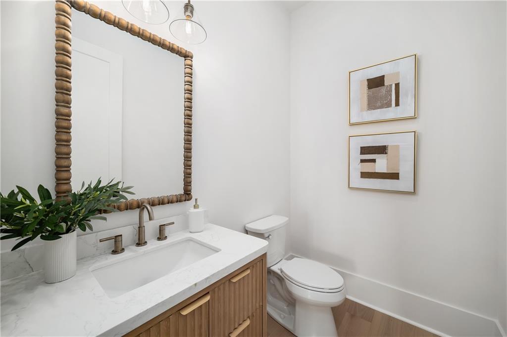 245 Lask Lane Milton, GA 30004 - Photo 37 of 87 a bathroom with a sink a toilet and a mirror