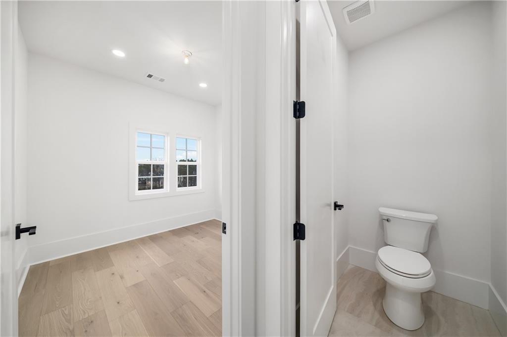 245 Lask Lane Milton, GA 30004 - Photo 47 of 87 a bathroom with a toilet sink
