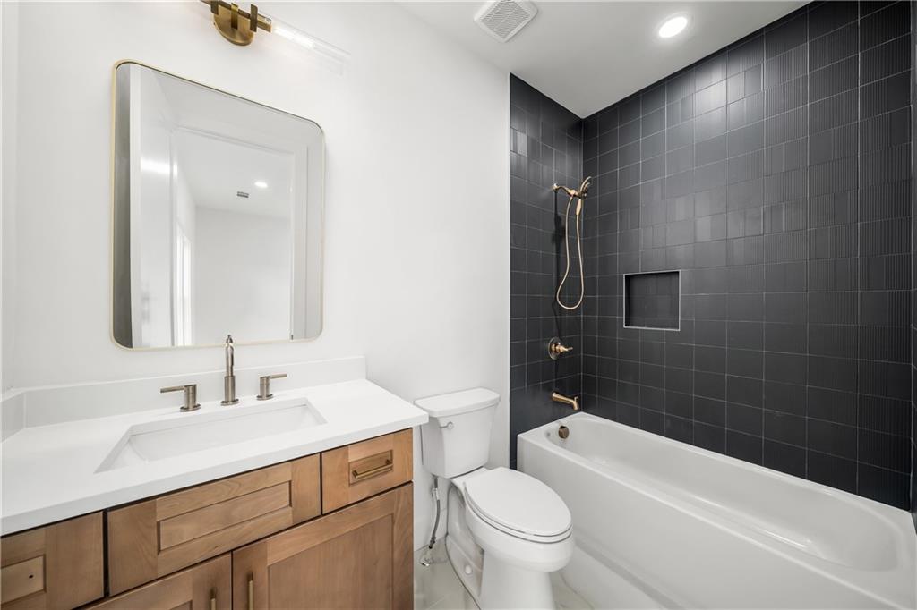 245 Lask Lane Milton, GA 30004 - Photo 52 of 87 a bathroom with a sink a toilet and shower