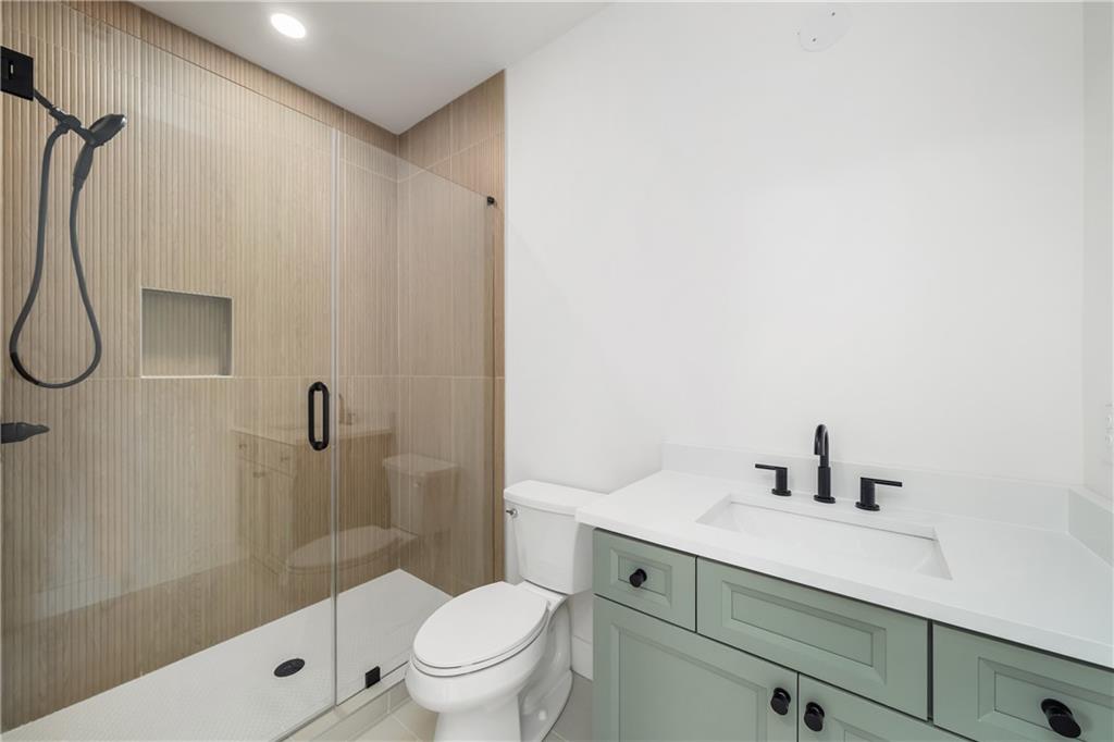 245 Lask Lane Milton, GA 30004 - Photo 55 of 87 a bathroom with a sink a toilet and shower