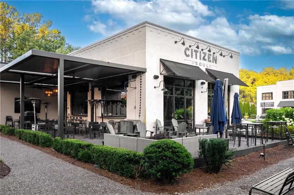245 Lask Lane Milton, GA 30004 - Photo 77 of 87 a view of a house with potted plants and a barbeque