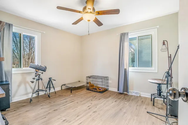 a room that has a bed and a chair in it