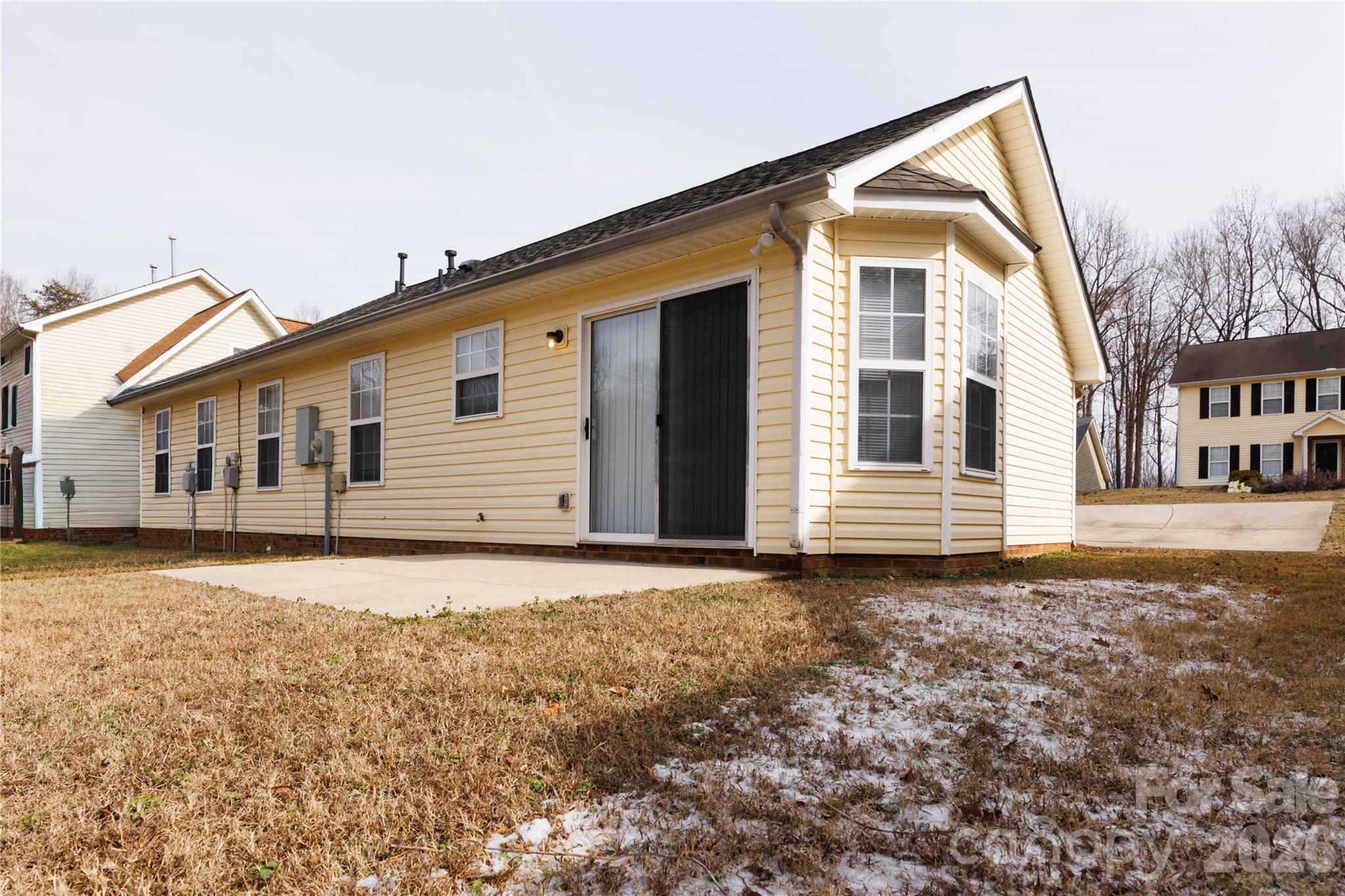 7111 Rumple Road Charlotte, NC 28262 - Photo 17 of 18 a front view of a house with a yard