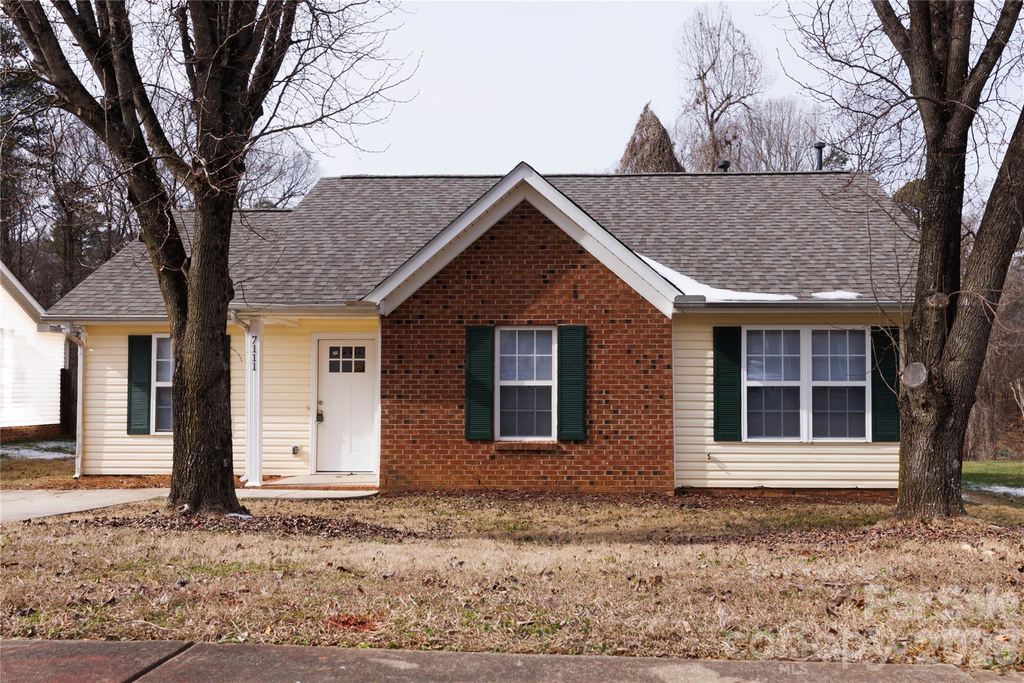 7111 Rumple Road Charlotte, NC 28262 - Photo 2 of 18 a front view of a house with a yard
