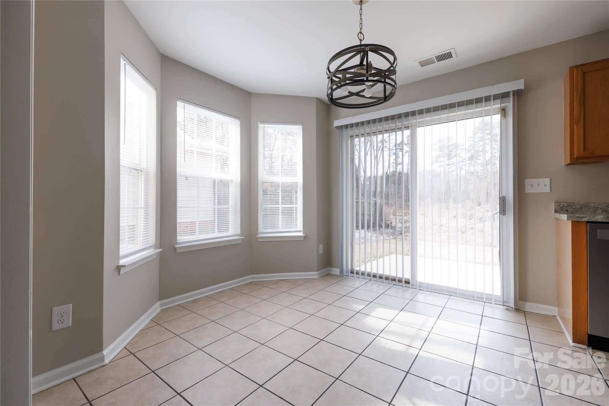 7111 Rumple Road Charlotte, NC 28262 - Photo 7 of 18 a view of an empty room with a window