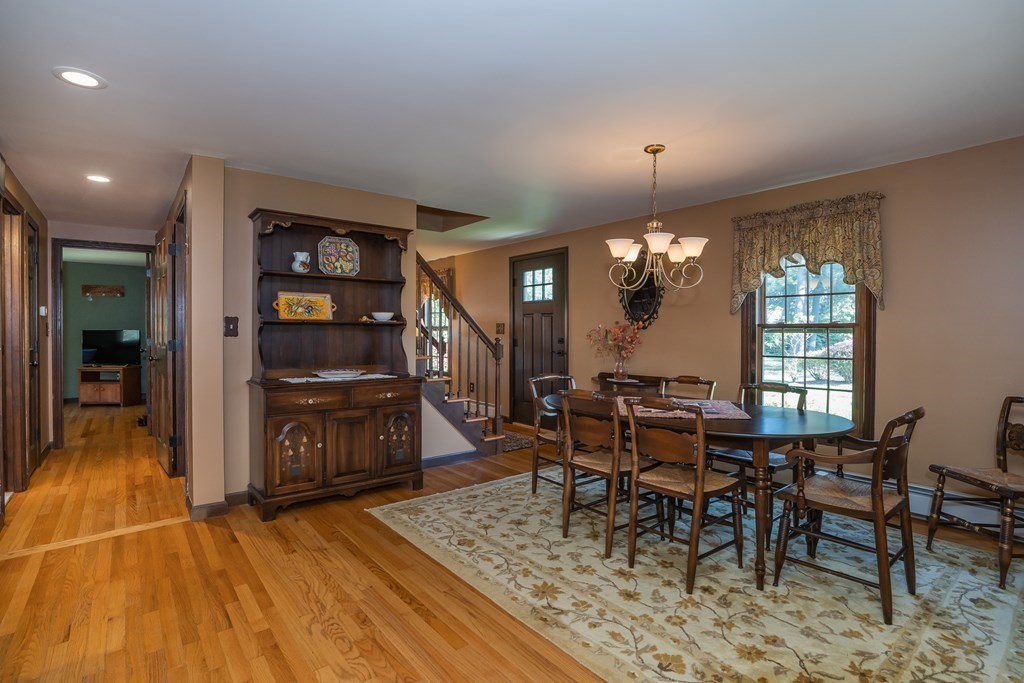53 Yankee Circle Westfield, MA 01085 - Photo 12 of 42 a dining room with furniture a chandelier and wooden floor