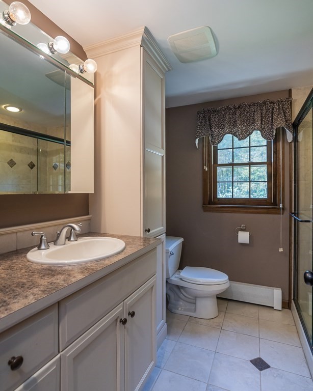 53 Yankee Circle Westfield, MA 01085 - Photo 18 of 42 a bathroom with a granite countertop toilet a sink and a mirror