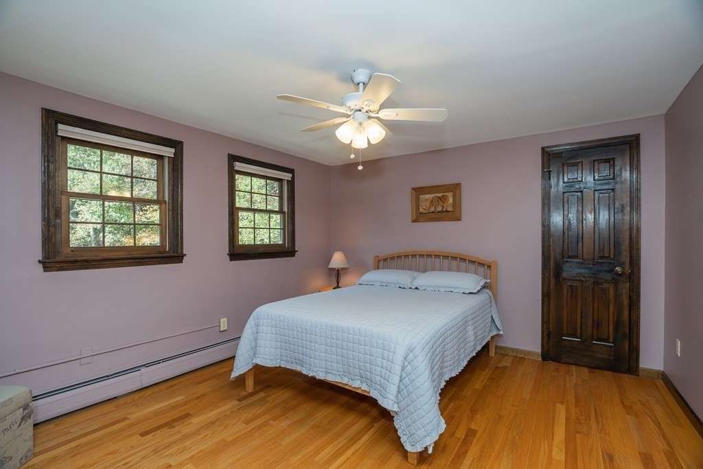 53 Yankee Circle Westfield, MA 01085 - Photo 29 of 42 a bedroom with a bed and a chandelier