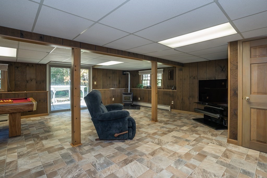 53 Yankee Circle Westfield, MA 01085 - Photo 30 of 42 a living room with furniture a flat screen tv and a refrigerator
