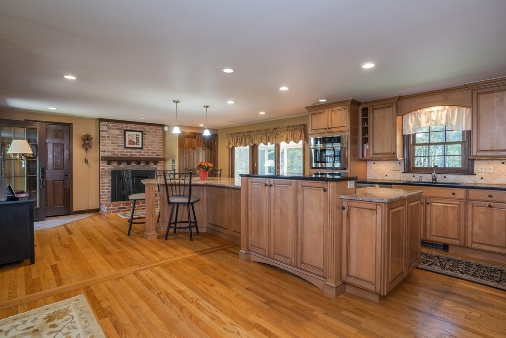 53 Yankee Circle Westfield, MA 01085 - Photo 3 of 42 a open kitchen with stainless steel appliances granite countertop a refrigerator and cabinets