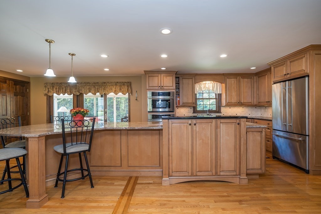 53 Yankee Circle Westfield, MA 01085 - Photo 4 of 42 a kitchen with stainless steel appliances granite countertop a refrigerator sink and cabinets
