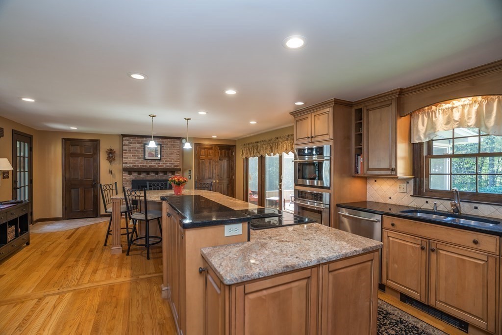 53 Yankee Circle Westfield, MA 01085 - Photo 5 of 42 a kitchen with stainless steel appliances granite countertop sink stove top oven and cabinets