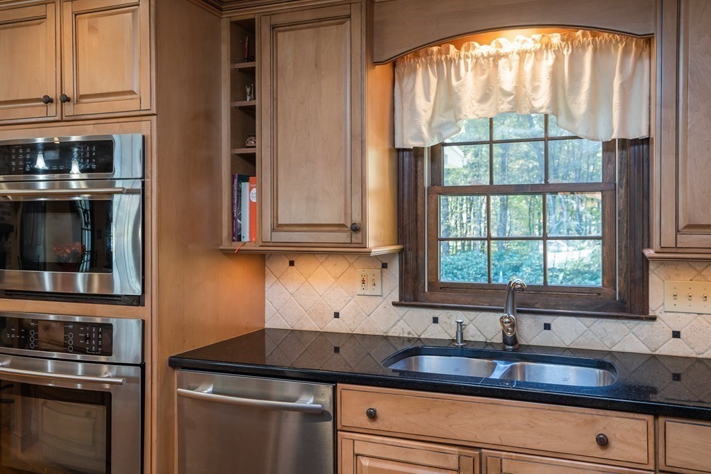 53 Yankee Circle Westfield, MA 01085 - Photo 6 of 42 a kitchen with granite countertop a sink and a stove