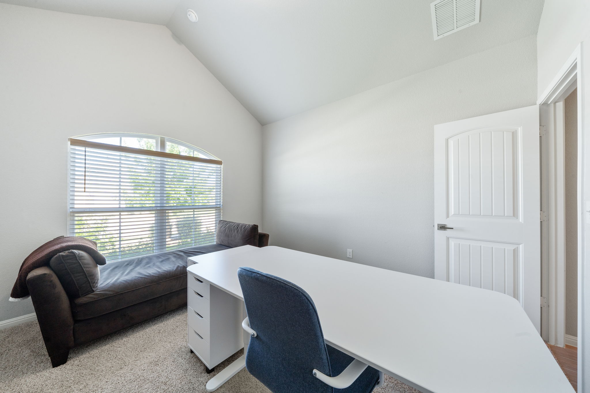 2412 Starhill Ranch Street Georgetown, TX 78628 - Photo 6 of 40 An airy office space offers a vaulted ceiling, providing a refreshing work-from-home environment.