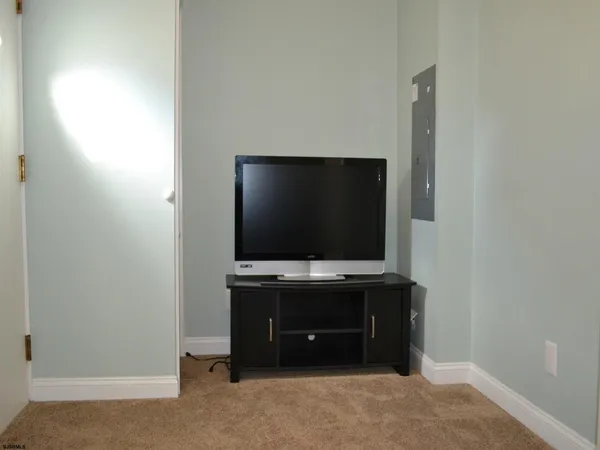 a room with furniture and flat screen tv