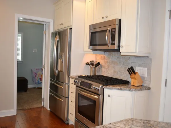 a kitchen with a stove and a microwave