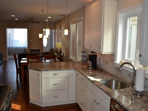 a kitchen with a sink stove and cabinets