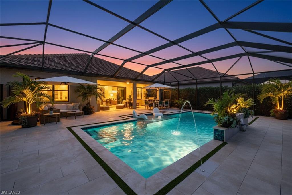3967 Pegasus Way Naples, FL 34120 - Photo 2 of 50 a view of a swimming pool with a patio