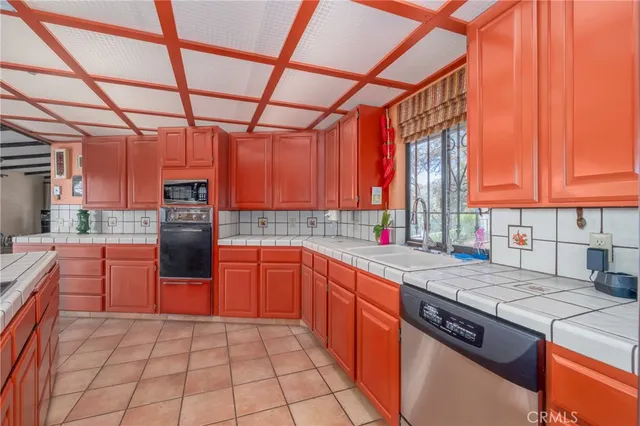 a view of a living room and kitchen