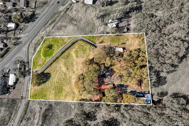 a living room with fireplace furniture and a large window