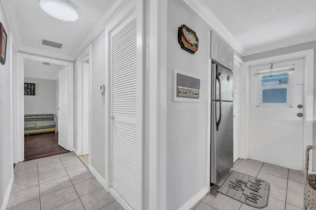 a view of a kitchen from the hallway