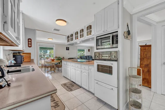 a kitchen with stainless steel appliances granite countertop a stove and a sink