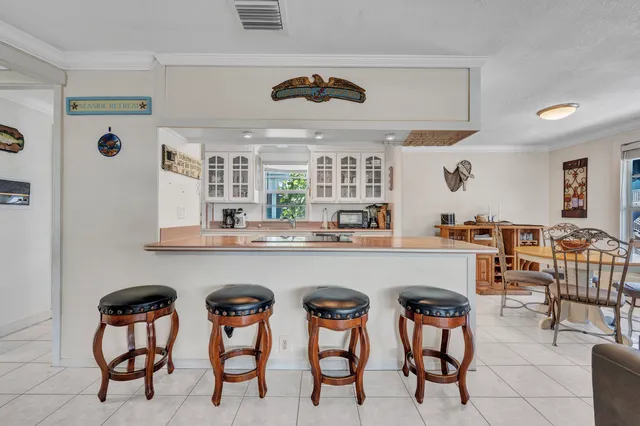 a kitchen with a table and chairs in it