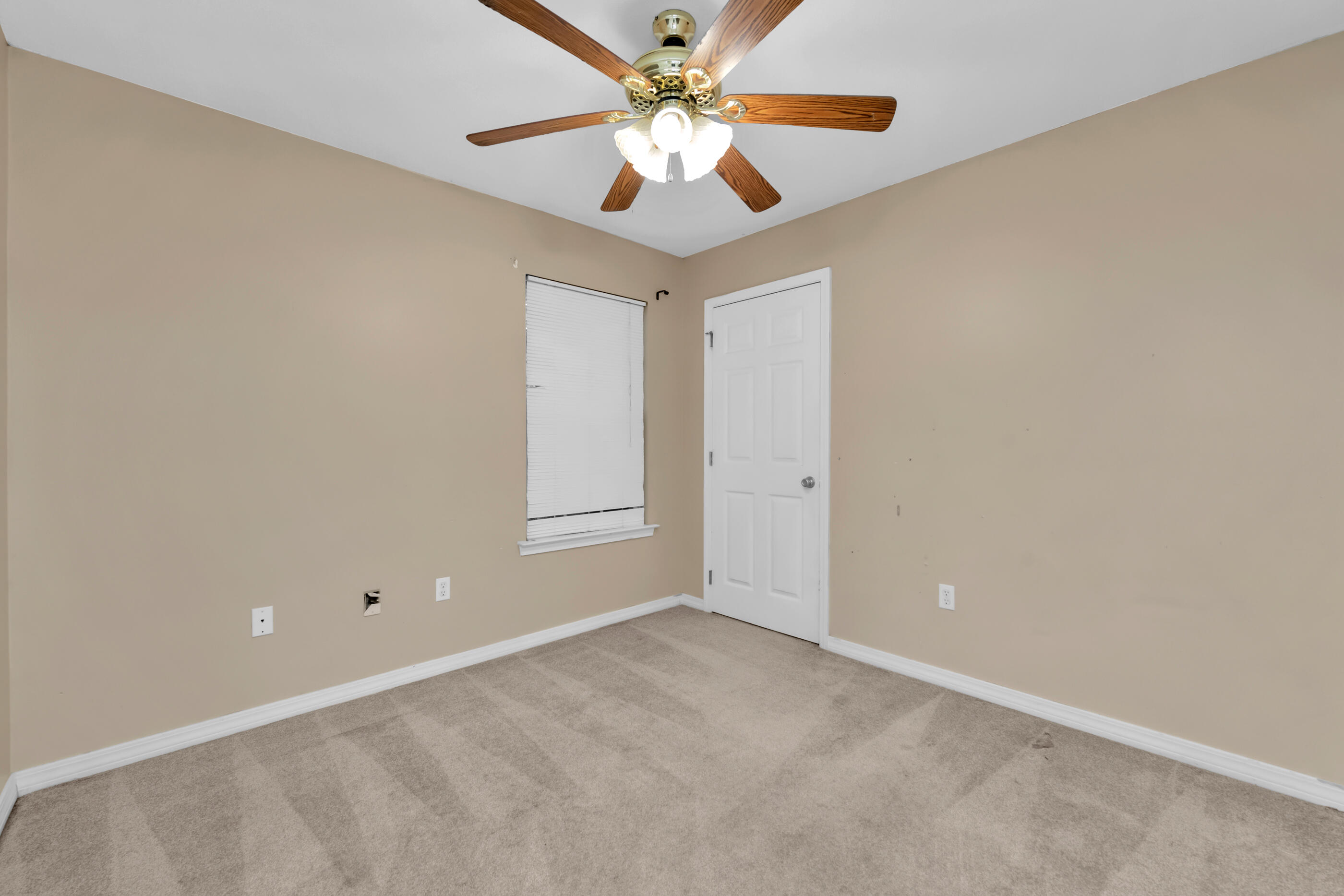 706 Brock Avenue Crestview, FL 32539 - Photo 12 of 18 an empty room with closet and a ceiling fan