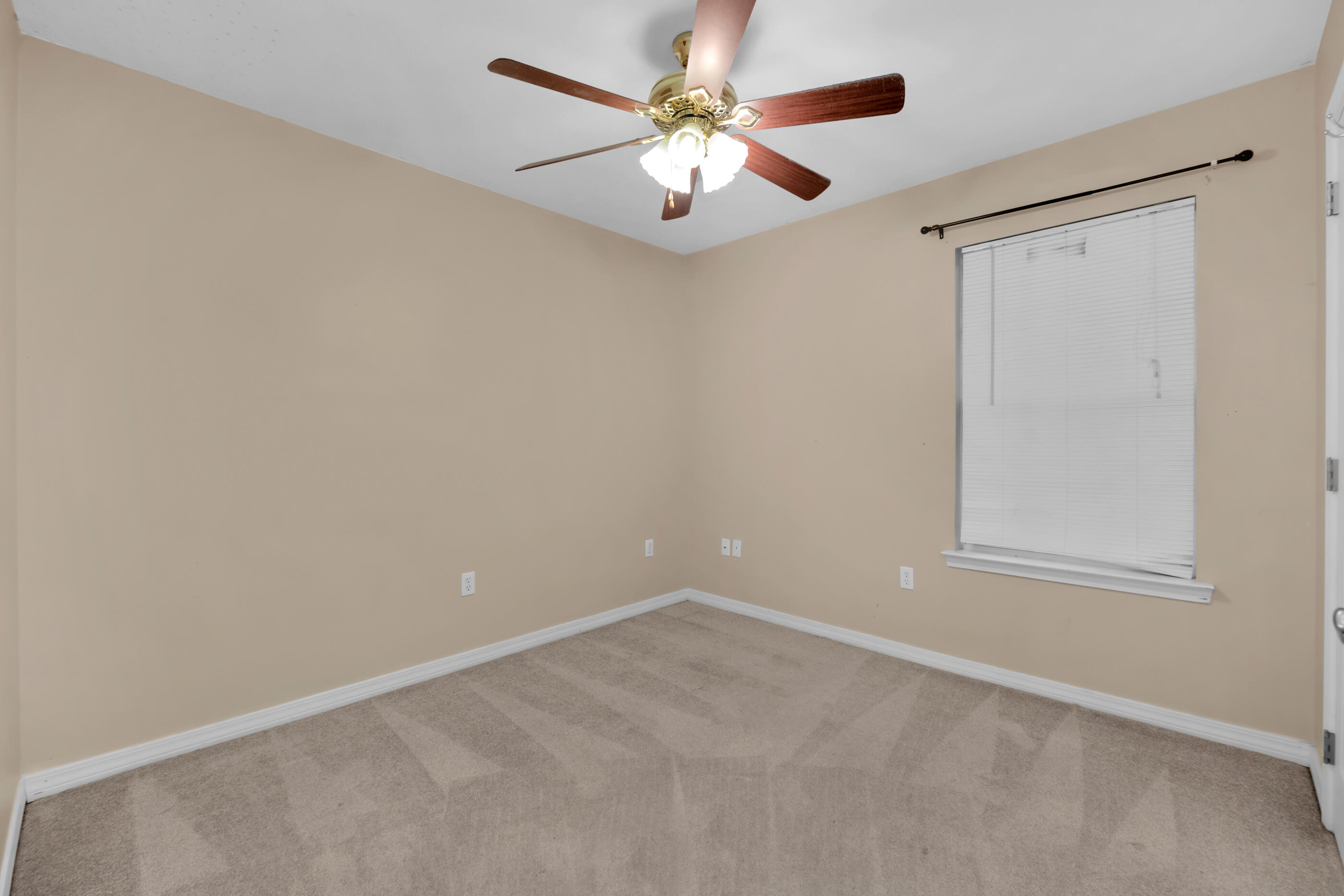 706 Brock Avenue Crestview, FL 32539 - Photo 13 of 18 a view of an empty room with a window
