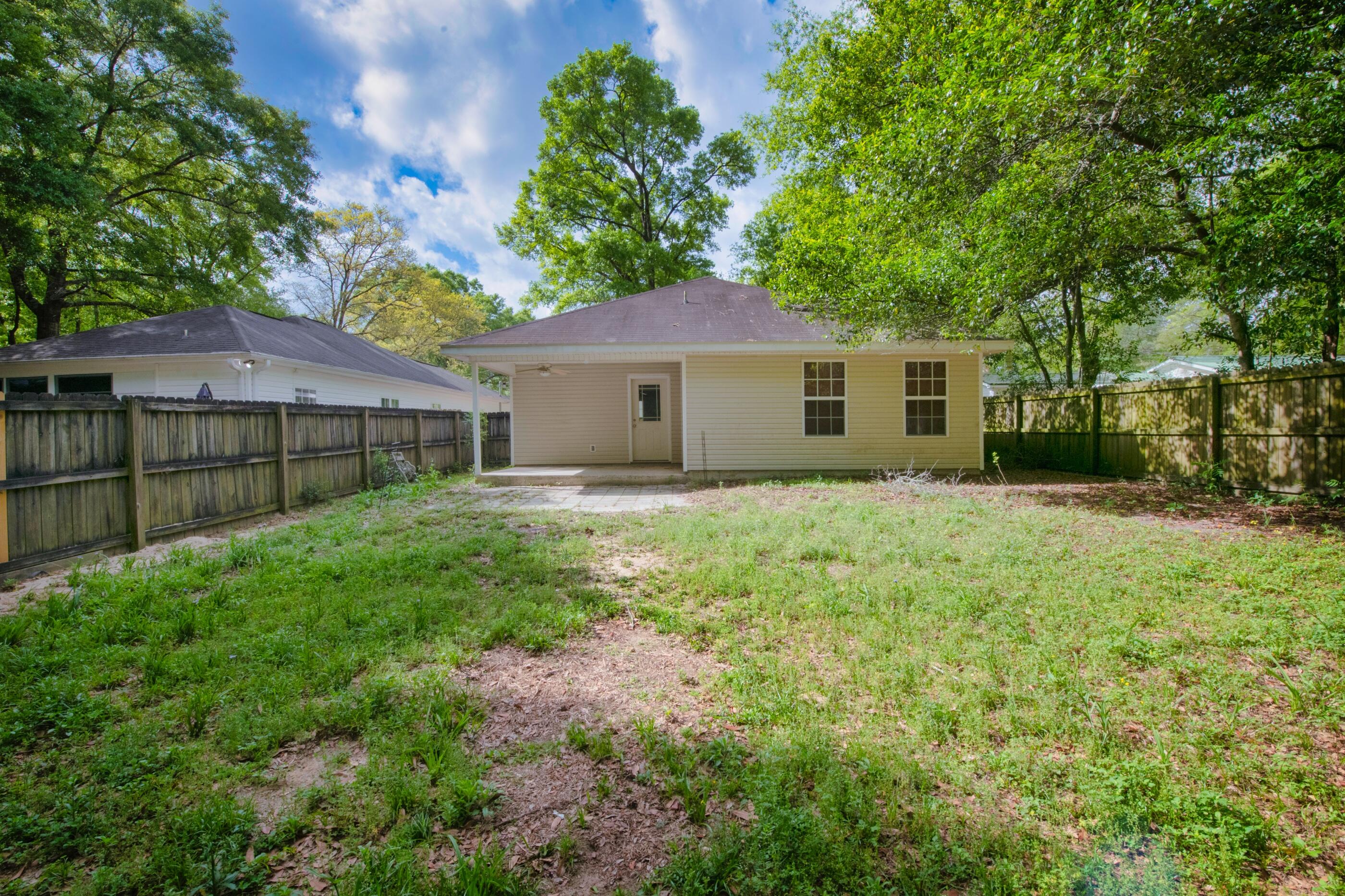 706 Brock Avenue Crestview, FL 32539 - Photo 16 of 18 a front view of house with yard and green space