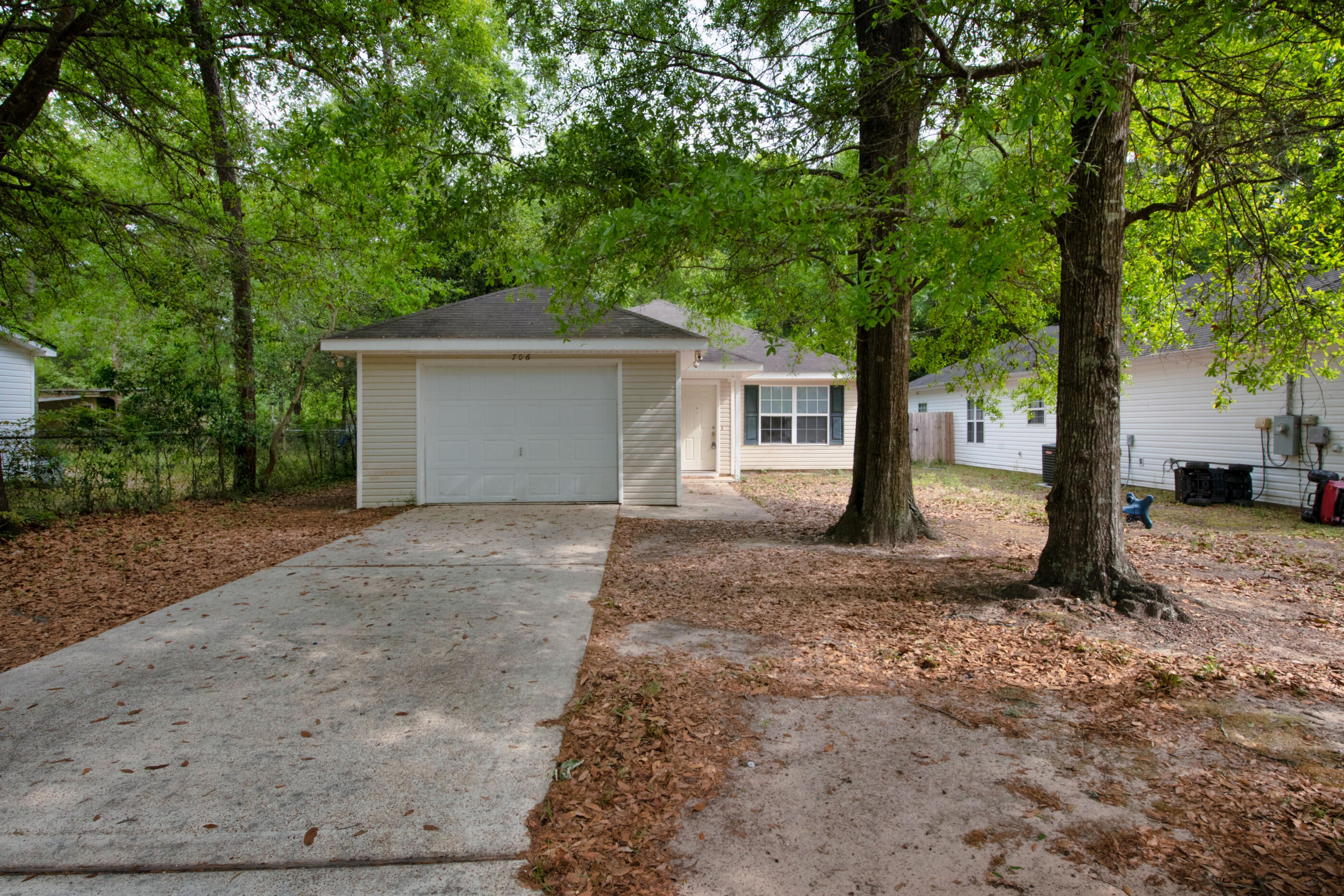 706 Brock Avenue Crestview, FL 32539 - Photo 18 of 18 a view of a house with a tree in front of it