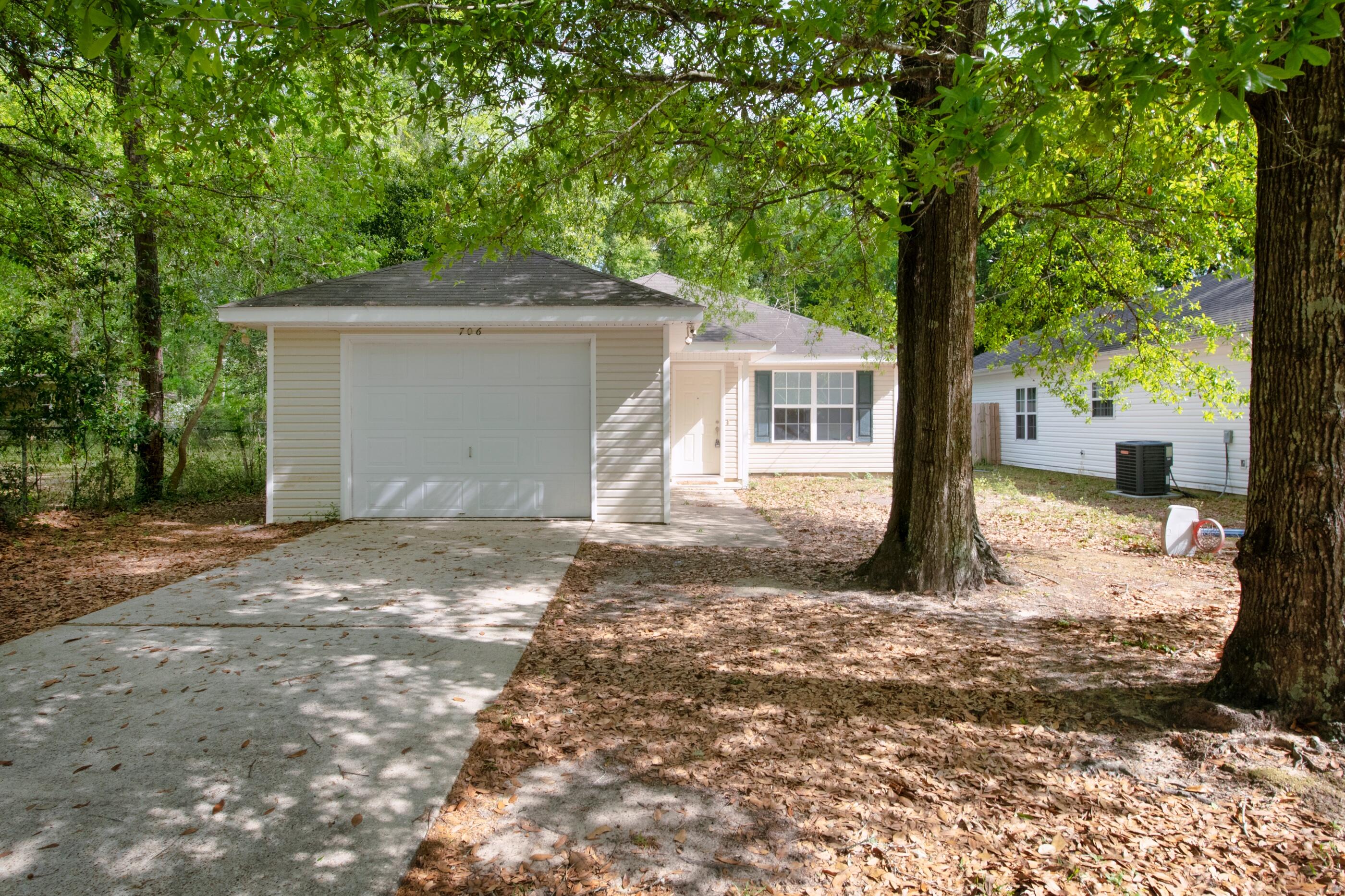 706 Brock Avenue Crestview, FL 32539 - Photo 2 of 18 a view of a house with a tree in the background