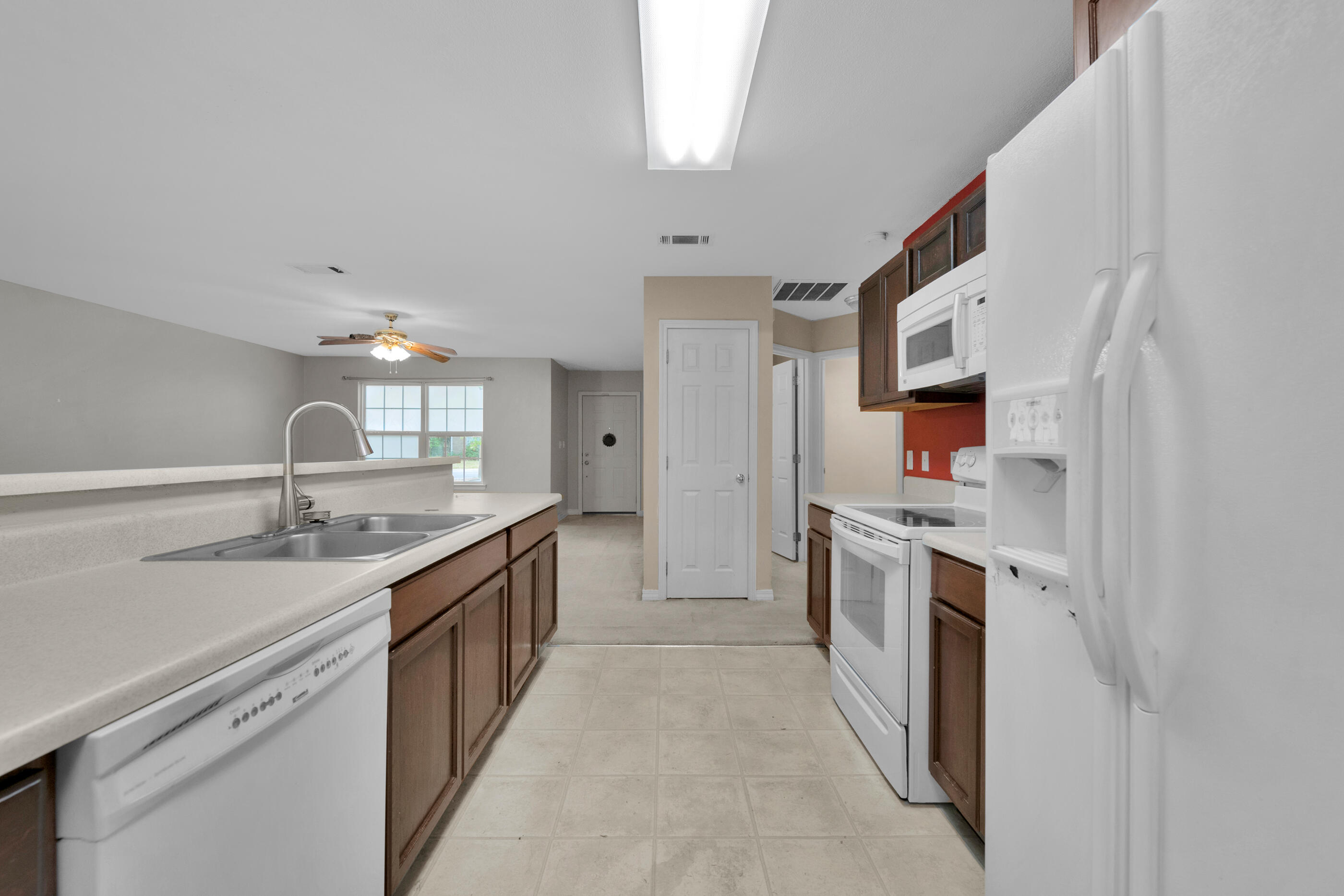 706 Brock Avenue Crestview, FL 32539 - Photo 8 of 18 a large kitchen with a stove top oven