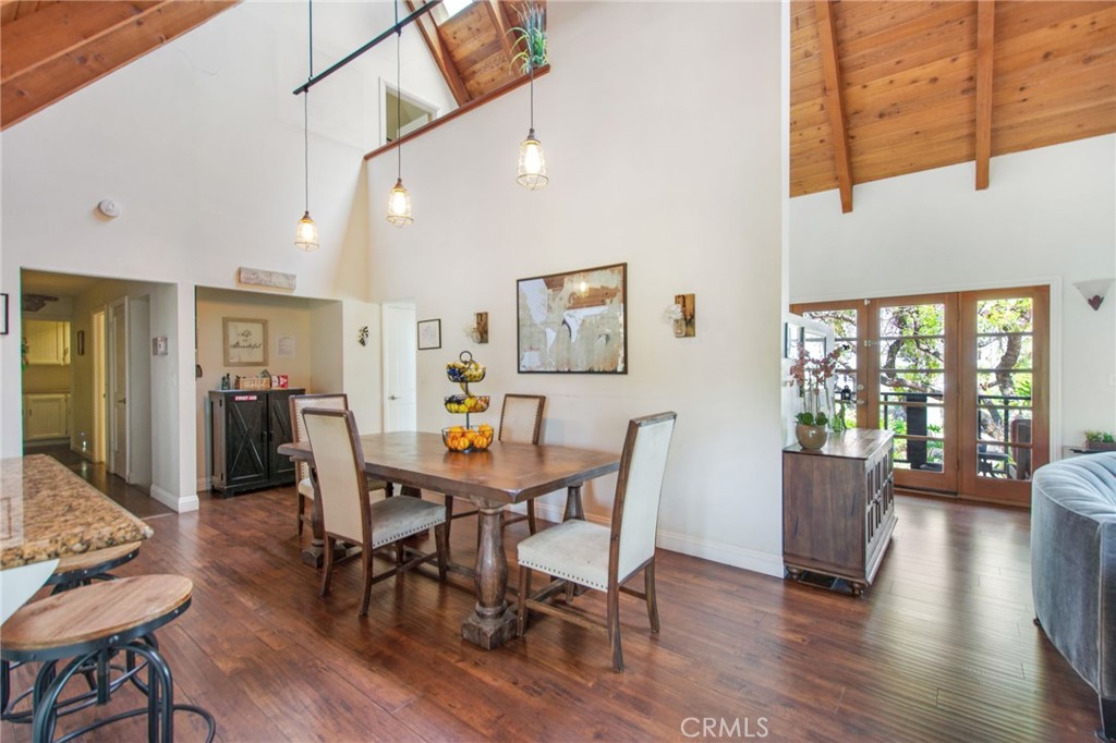 7241 Old Temescal Road Corona, CA 92881 - Photo 32 of 47 a view of a dining room with furniture window and wooden floor