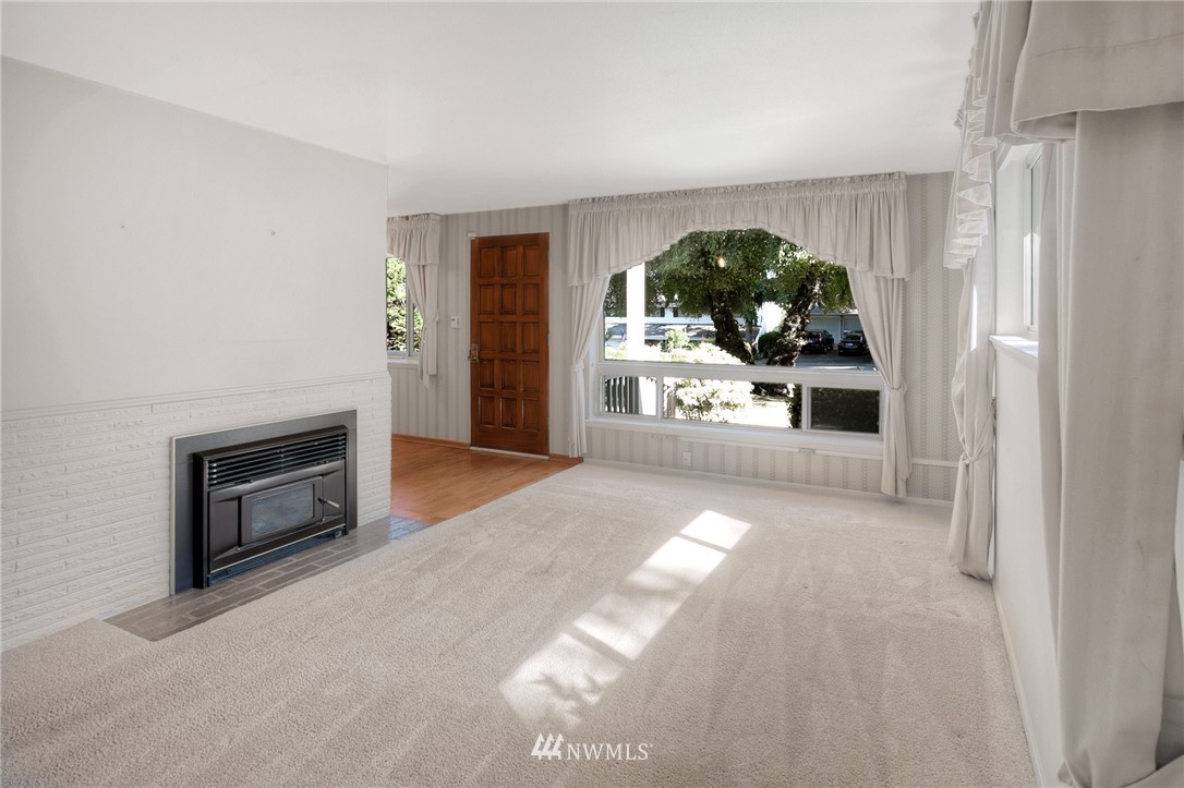 619 Southwest Normandy Road Normandy Park, WA 98166 - Photo 2 of 24 a view of a livingroom with a fireplace