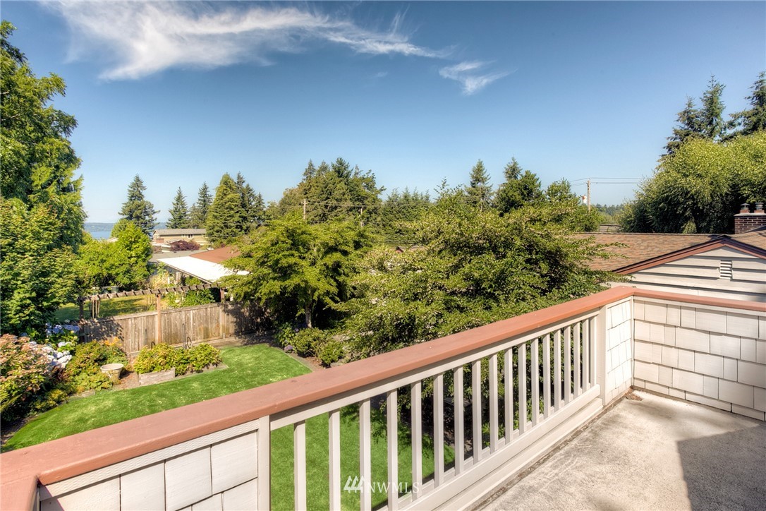 619 Southwest Normandy Road Normandy Park, WA 98166 - Photo 21 of 24 a balcony with trees in front of it